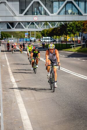 MOSCOW, RUSSIA - AUGUST 25, 2019: Ironman Cycling competition, cyclist athletes riding a race. Ironstar Crocus Fitness Triathlon.のeditorial素材