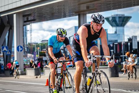 MOSCOW, RUSSIA - AUGUST 25, 2019: Ironman Cycling competition, cyclist athletes riding a race. Ironstar Crocus Fitness Triathlon.のeditorial素材