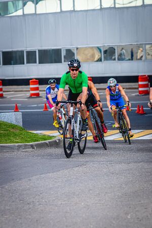 MOSCOW, RUSSIA - AUGUST 25, 2019: Ironman Cycling competition, cyclist athletes riding a race. Ironstar Crocus Fitness Triathlon.のeditorial素材