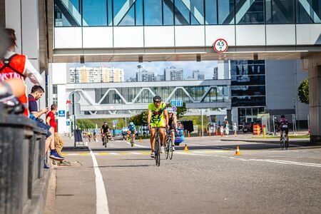 MOSCOW, RUSSIA - AUGUST 25, 2019: Ironman Cycling competition, cyclist athletes riding a race. Ironstar Crocus Fitness Triathlon.のeditorial素材