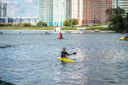 MOSCOW, RUSSIA - AUGUST 25, 2019: Young woman enjoys her kayak workout in the hot weather at Moscow river.のeditorial素材