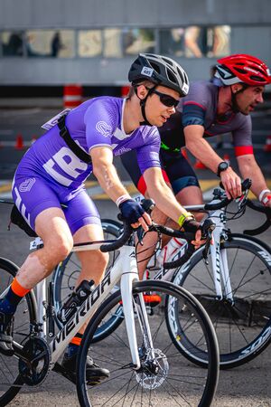 MOSCOW, RUSSIA - AUGUST 25, 2019: Ironman Cycling competition, cyclist athletes riding a race. Ironstar Crocus Fitness Triathlon.のeditorial素材