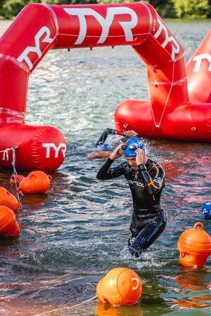 MOSCOW, RUSSIA - AUGUST 25, 2019: Ironman Swimmers on the open waters event Moscow river. Ironstar Crocus Fitness Triathlon 2019.のeditorial素材