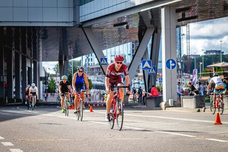 MOSCOW, RUSSIA - AUGUST 25, 2019: Ironman Cycling competition, cyclist athletes riding a race. Ironstar Crocus Fitness Triathlon.のeditorial素材