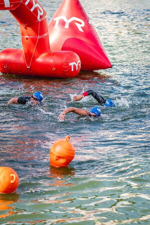 MOSCOW, RUSSIA - AUGUST 25, 2019: Ironman Swimmers on the open waters event Moscow river. Ironstar Crocus Fitness Triathlon 2019.のeditorial素材