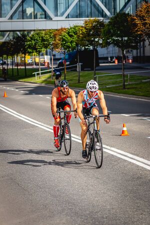 MOSCOW, RUSSIA - AUGUST 25, 2019: Ironman Cycling competition, cyclist athletes riding a race. Ironstar Crocus Fitness Triathlon.のeditorial素材