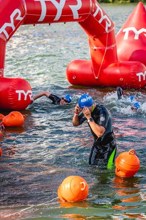 MOSCOW, RUSSIA - AUGUST 25, 2019: Ironman Swimmers on the open waters event Moscow river. Ironstar Crocus Fitness Triathlon 2019.のeditorial素材
