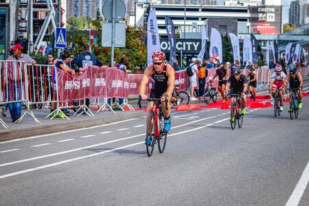 MOSCOW, RUSSIA - AUGUST 25, 2019: Ironman Cycling competition, cyclist athletes riding a race. Ironstar Crocus Fitness Triathlon.のeditorial素材