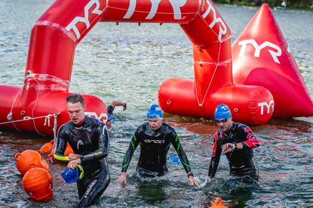 MOSCOW, RUSSIA - AUGUST 25, 2019: Ironman Swimmers on the open waters event Moscow river. Ironstar Crocus Fitness Triathlon 2019.のeditorial素材