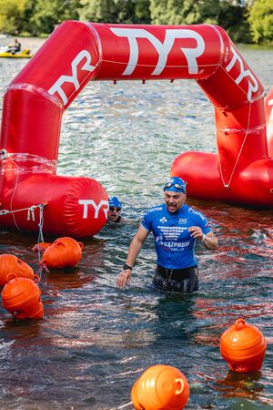 MOSCOW, RUSSIA - AUGUST 25, 2019: Ironman Swimmers on the open waters event Moscow river. Ironstar Crocus Fitness Triathlon 2019.のeditorial素材