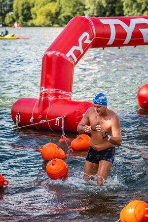 MOSCOW, RUSSIA - AUGUST 25, 2019: Ironman Swimmers on the open waters event Moscow river. Ironstar Crocus Fitness Triathlon 2019.のeditorial素材