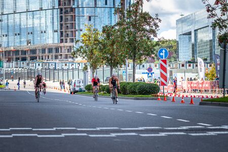 MOSCOW, RUSSIA - AUGUST 25, 2019: Ironman Cycling competition, cyclist athletes riding a race. Ironstar Crocus Fitness Triathlon.のeditorial素材