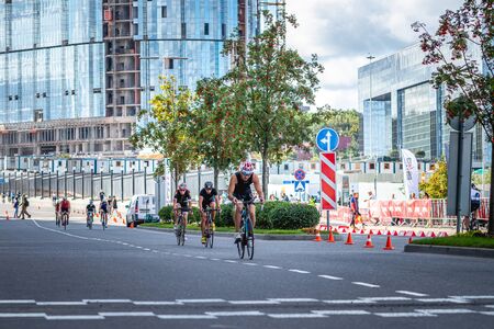 MOSCOW, RUSSIA - AUGUST 25, 2019: Ironman Cycling competition, cyclist athletes riding a race. Ironstar Crocus Fitness Triathlon.のeditorial素材