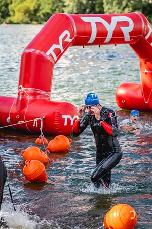 MOSCOW, RUSSIA - AUGUST 25, 2019: Ironman Swimmers on the open waters event Moscow river. Ironstar Crocus Fitness Triathlon 2019.のeditorial素材