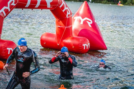 MOSCOW, RUSSIA - AUGUST 25, 2019: Ironman Swimmers on the open waters event Moscow river. Ironstar Crocus Fitness Triathlon 2019.のeditorial素材