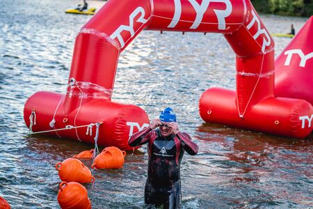 MOSCOW, RUSSIA - AUGUST 25, 2019: Ironman Swimmers on the open waters event Moscow river. Ironstar Crocus Fitness Triathlon 2019.のeditorial素材