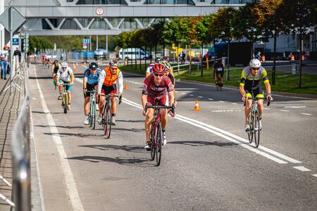 MOSCOW, RUSSIA - AUGUST 25, 2019: Ironman Cycling competition, cyclist athletes riding a race. Ironstar Crocus Fitness Triathlon.のeditorial素材