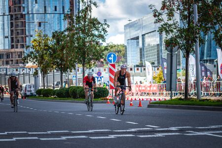 MOSCOW, RUSSIA - AUGUST 25, 2019: Ironman Cycling competition, cyclist athletes riding a race. Ironstar Crocus Fitness Triathlon.のeditorial素材