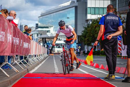 MOSCOW, RUSSIA - AUGUST 25, 2019: Ironman Cycling competition, cyclist athletes riding a race. Ironstar Crocus Fitness Triathlon.のeditorial素材