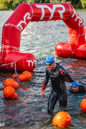 MOSCOW, RUSSIA - AUGUST 25, 2019: Ironman Swimmers on the open waters event Moscow river. Ironstar Crocus Fitness Triathlon 2019.のeditorial素材