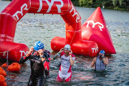 MOSCOW, RUSSIA - AUGUST 25, 2019: Ironman Swimmers on the open waters event Moscow river. Ironstar Crocus Fitness Triathlon 2019.のeditorial素材
