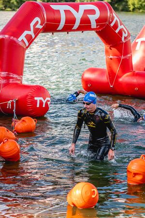 MOSCOW, RUSSIA - AUGUST 25, 2019: Ironman Swimmers on the open waters event Moscow river. Ironstar Crocus Fitness Triathlon 2019.のeditorial素材