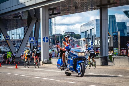 MOSCOW, RUSSIA - AUGUST 25, 2019: Ironman Cycling competition, cyclist athletes riding a race. Ironstar Crocus Fitness Triathlon.のeditorial素材