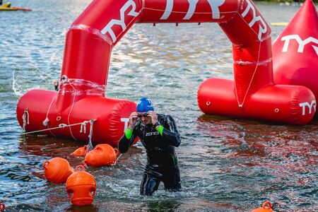 MOSCOW, RUSSIA - AUGUST 25, 2019: Ironman Swimmers on the open waters event Moscow river. Ironstar Crocus Fitness Triathlon 2019.のeditorial素材
