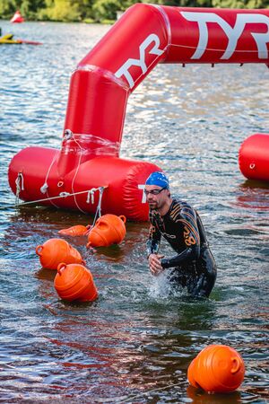 MOSCOW, RUSSIA - AUGUST 25, 2019: Ironman Swimmers on the open waters event Moscow river. Ironstar Crocus Fitness Triathlon 2019.のeditorial素材