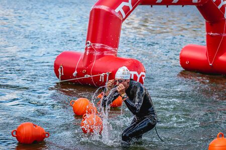 MOSCOW, RUSSIA - AUGUST 25, 2019: Ironman Swimmers on the open waters event Moscow river. Ironstar Crocus Fitness Triathlon 2019.のeditorial素材