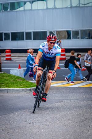MOSCOW, RUSSIA - AUGUST 25, 2019: Ironman Cycling competition, cyclist athletes riding a race. Ironstar Crocus Fitness Triathlon.のeditorial素材