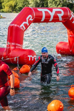 MOSCOW, RUSSIA - AUGUST 25, 2019: Ironman Swimmers on the open waters event Moscow river. Ironstar Crocus Fitness Triathlon 2019.のeditorial素材