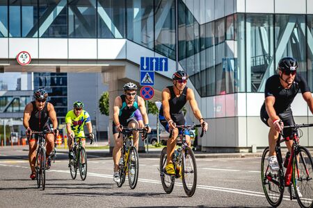 MOSCOW, RUSSIA - AUGUST 25, 2019: Ironman Cycling competition, cyclist athletes riding a race. Ironstar Crocus Fitness Triathlon.のeditorial素材