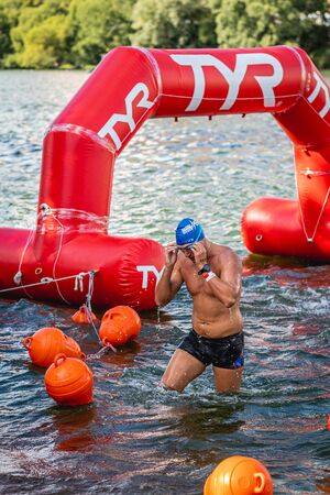 MOSCOW, RUSSIA - AUGUST 25, 2019: Ironman Swimmers on the open waters event Moscow river. Ironstar Crocus Fitness Triathlon 2019.のeditorial素材