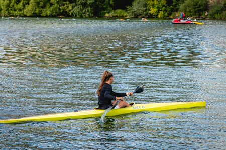 MOSCOW, RUSSIA - AUGUST 25, 2019: Young woman enjoys her kayak workout in the hot weather at Moscow river.のeditorial素材