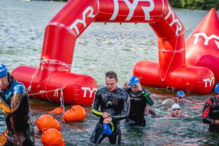 MOSCOW, RUSSIA - AUGUST 25, 2019: Ironman Swimmers on the open waters event Moscow river. Ironstar Crocus Fitness Triathlon 2019.のeditorial素材