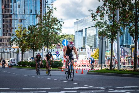 MOSCOW, RUSSIA - AUGUST 25, 2019: Ironman Cycling competition, cyclist athletes riding a race. Ironstar Crocus Fitness Triathlon.のeditorial素材