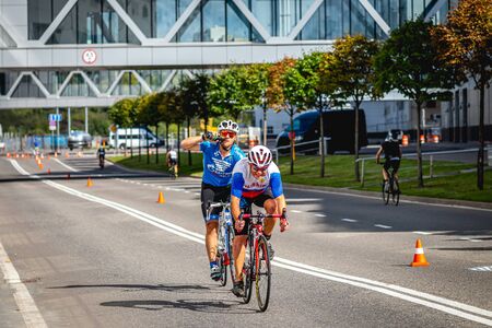 MOSCOW, RUSSIA - AUGUST 25, 2019: Ironman Cycling competition, cyclist athletes riding a race. Ironstar Crocus Fitness Triathlon.のeditorial素材