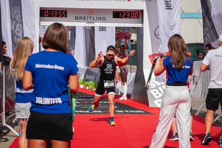 MOSCOW, RUSSIA - AUGUST 25, 2019: Finish line on Ironstar Crocus Fitness Triathlon 2019. Athlete, ironman, triathlon.のeditorial素材