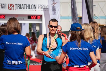 MOSCOW, RUSSIA - AUGUST 25, 2019: Finish line on Ironstar Crocus Fitness Triathlon 2019. Athlete, ironman, triathlon.のeditorial素材
