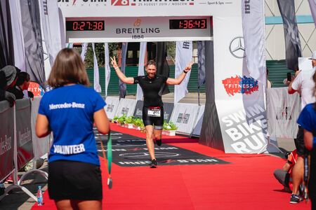 MOSCOW, RUSSIA - AUGUST 25, 2019: Finish line on Ironstar Crocus Fitness Triathlon 2019. Athlete, ironman, triathlon.のeditorial素材