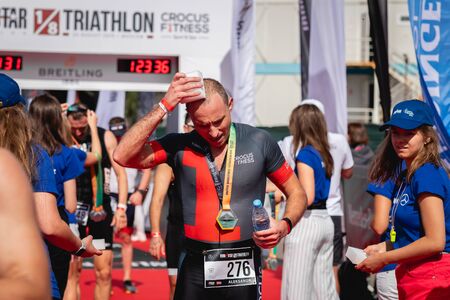 MOSCOW, RUSSIA - AUGUST 25, 2019: Finish line on Ironstar Crocus Fitness Triathlon 2019. Athlete, ironman, triathlon.のeditorial素材