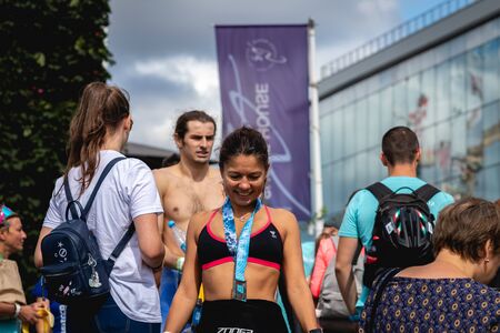 MOSCOW, RUSSIA - AUGUST 25, 2019: Athletes with medals on IRONSTAR CROCUS FITNESS TRIATHLON 2019.のeditorial素材