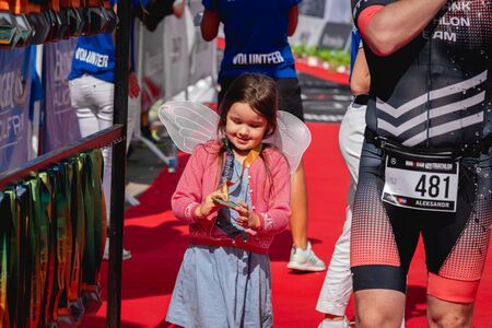 MOSCOW, RUSSIA - AUGUST 25, 2019: A girl on Finish line on Ironstar Crocus Fitness Triathlon 2019.のeditorial素材