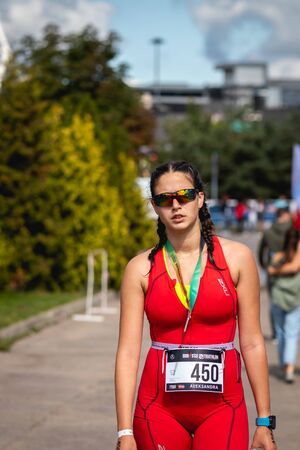 MOSCOW, RUSSIA - AUGUST 25, 2019: Athletes with medals on IRONSTAR CROCUS FITNESS TRIATHLON 2019.のeditorial素材