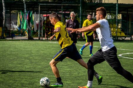 MOSCOW, RUSSIA - AUGUST 24, 2019: Soccer players in game. Amateur league in Russia.のeditorial素材