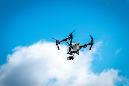 MOSCOW, RUSSIA - AUGUST 25, 2019: Drone flying over the blue sky background. Aerial.のeditorial素材