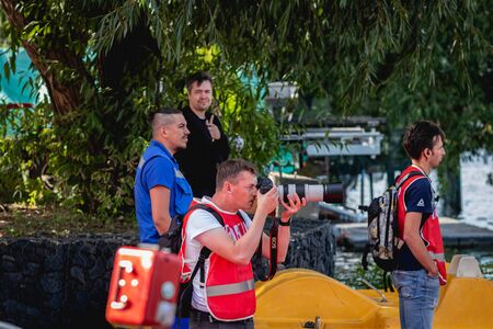 MOSCOW, RUSSIA - AUGUST 25, 2019: Sport photographer on Ironstar Crocus Fitness Triathlon 2019. Triathlon photographer.のeditorial素材
