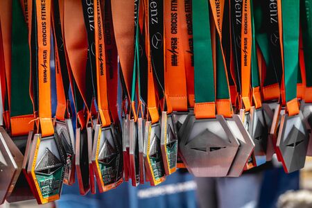 MOSCOW, RUSSIA - AUGUST 25, 2019: Medals for rewarding participants after the triathlon.のeditorial素材