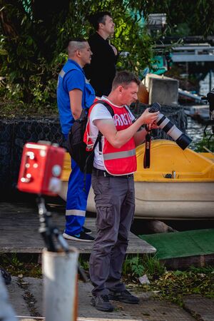 MOSCOW, RUSSIA - AUGUST 25, 2019: Sport photographer on Ironstar Crocus Fitness Triathlon 2019. Triathlon photographer.のeditorial素材